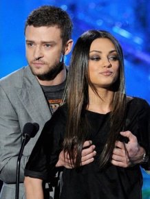 Justin grabs Mila Kunis