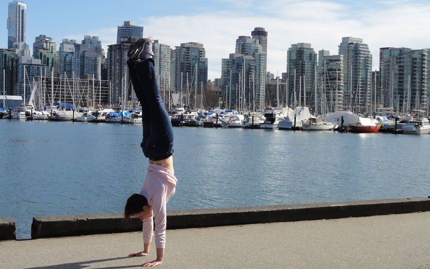 Young Woman Does Handstands for Good Cause 