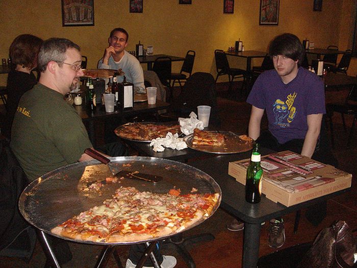 People Consuming Large Things