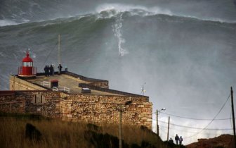 Hawaiian surfer Garrett McNamara on a huge wave in Portugal