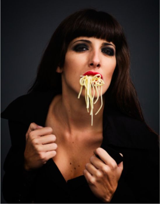 Women Eating Pasta Stock Photos