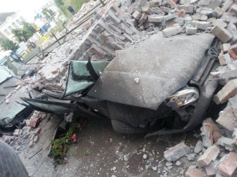 Cars Demolished by a Brick Wall