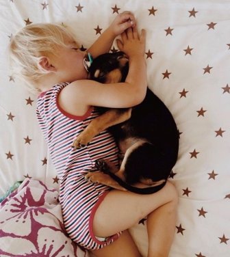 A Toddler and a Puppy Take a Nap