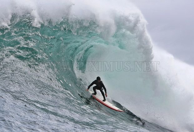 Surfing on a big wave in Cape Town