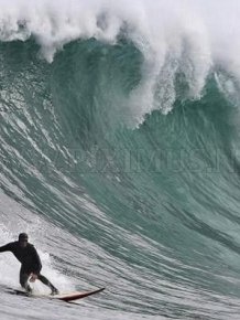 Surfing on a big wave in Cape Town