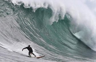 Surfing on a big wave in Cape Town