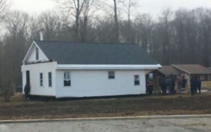 Amish Men Carrying a House