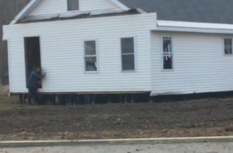 Amish Men Carrying a House