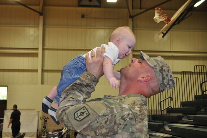 Soldiers Return Home To Meet Their Children