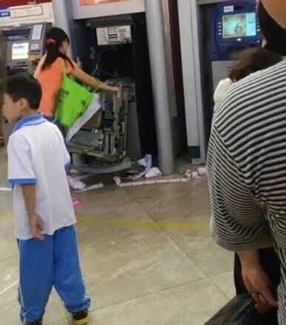 Woman Breaks ATM