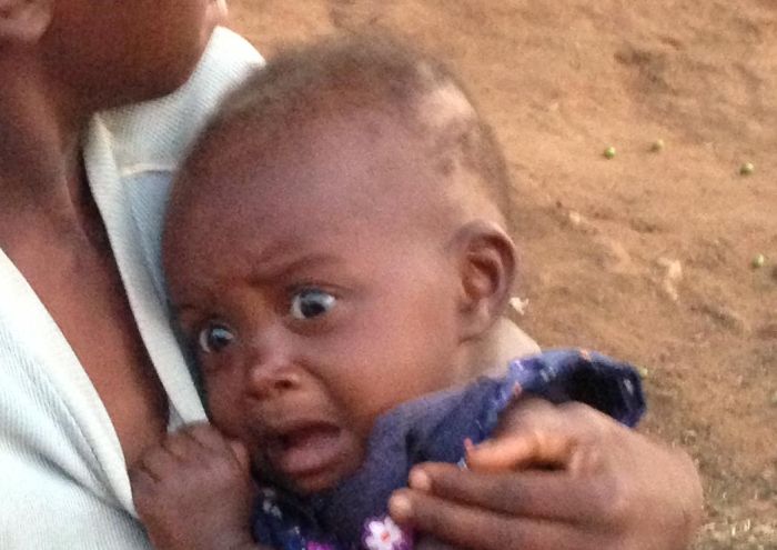 African Baby Sees A White Person For The First Time