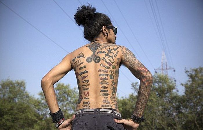 Meet The Man Who Covered His Body With Brand Logo Tattoos
