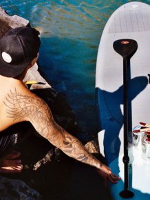 Hawaiian Artist Paints Incredible Seaside Murals While On A Surfboard