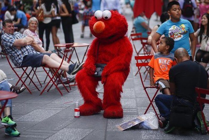 Costumed Characters Hanging Out In Public Doing Everyday Things