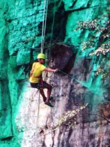 Man Hires Workers In China To Paint A 900 Foot Cliff Green