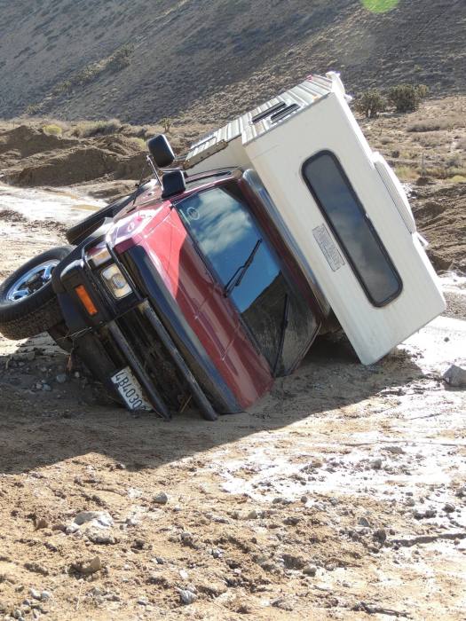 California Highway Workers Try To Uncover Vehicles Trapped In Landslide