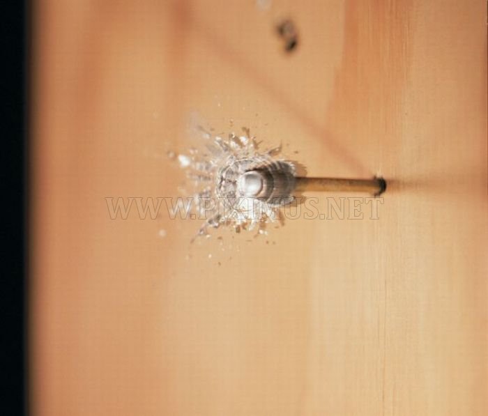 High-Speed Photographs of Bullets