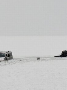 Two Hummers Got Stuck in Frozen Lake 