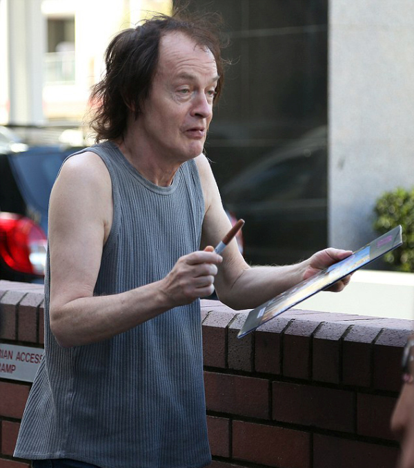 AC/DC Guitarist Angus Young Steps Out To Sign Autographs For Fans