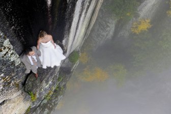 Couple Takes Extreme Wedding Photos On The Edge Of A Cliff