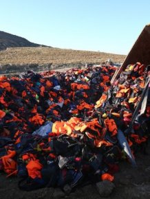 Refugees Use Life Jackets To Display A Message Of Peace On A Greek island