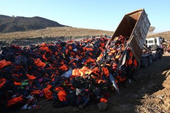 Refugees Use Life Jackets To Display A Message Of Peace On A Greek island