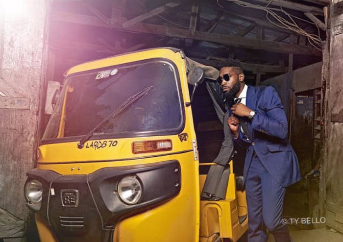 Street Seller Gets A Modeling Contract After Photobombing Tinie Tempah's Photo Shoot