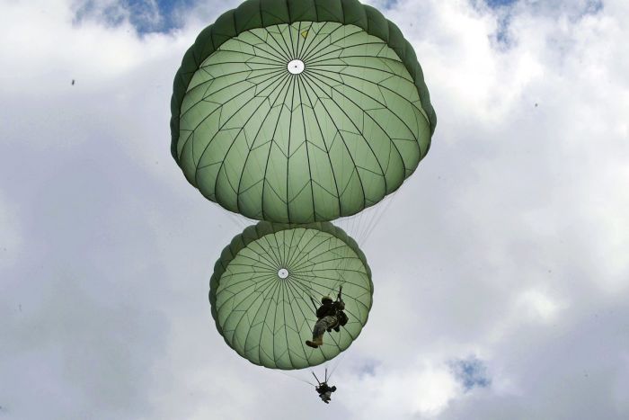 US Marines Jump Out Of A Plane And Into Action