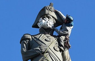 Greenpeace Protesters Climb Nelson's Column To Put A Gas Mask On The Statue