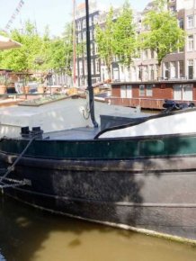 Old Boat Gets Converted Into A Beautiful House Barge