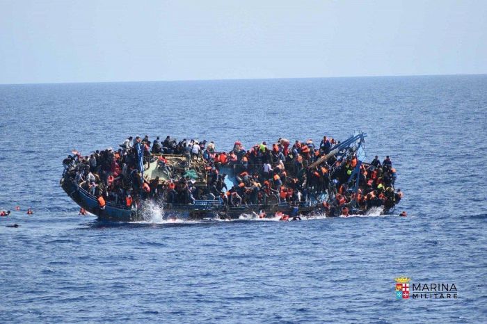 Italian Navy Rescues Migrants After Their Boat Reaches A Tipping Point