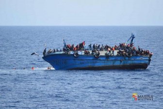 Italian Navy Rescues Migrants After Their Boat Reaches A Tipping Point