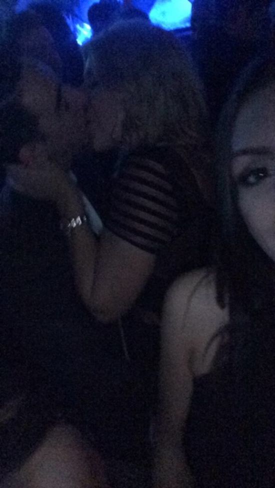Girl Takes Selfies With Random Couples While They're Making Out