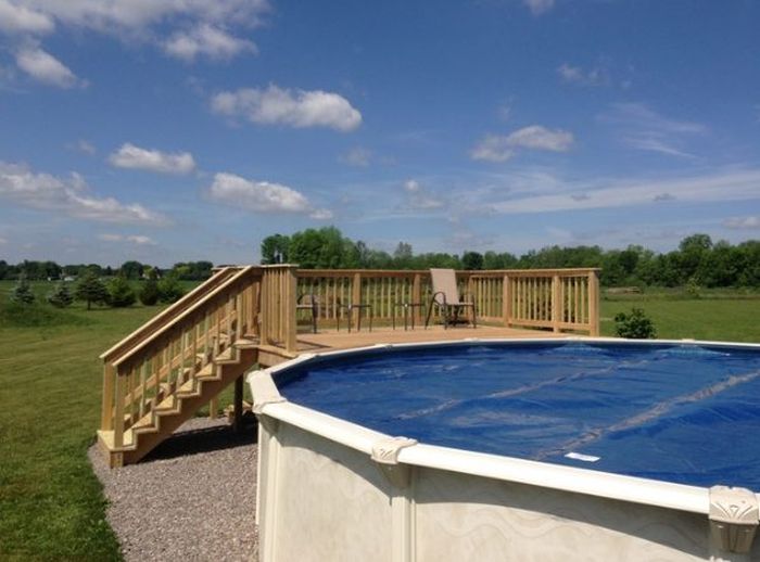 Adding A Deck To Your Above Ground Pool Will Make It Look Way Cooler