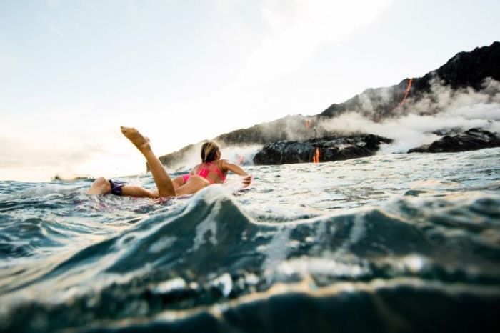 Adventurous Surfer Swims Near Erupting Volcano In Hawaii