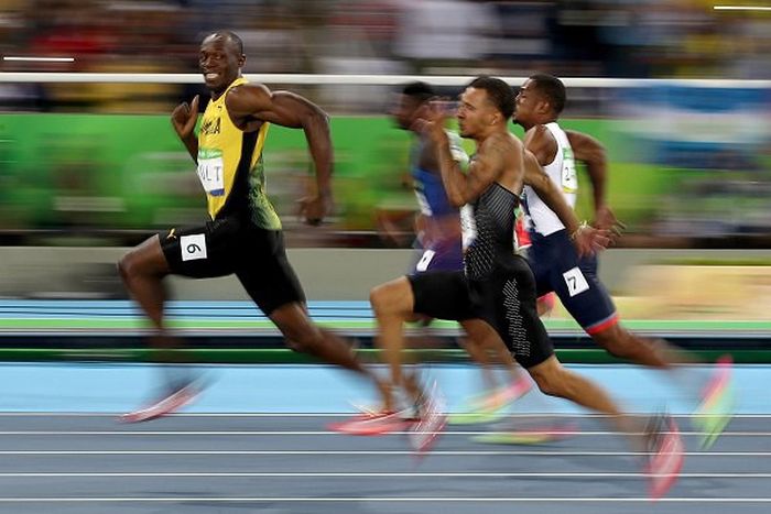 Usain Bolt Smiles For The Camera As He Zooms Past His Olympic Opponents