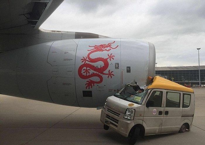 Hong Kong Plane Crushes Service Van On Airport Runway