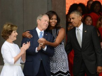 A Photoshop Battle Ensued Shortly After Michelle Obama Hugged George W. Bush