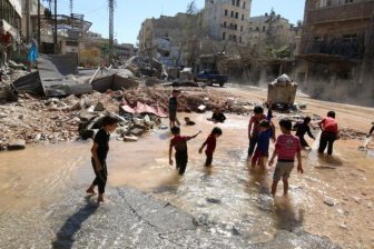 Chrildren Play With Water In A War Zone