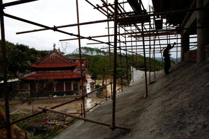 Handyman At Buddhist Temple Constantly Trains On The Job