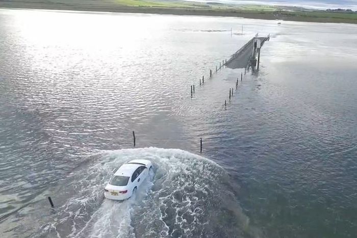 Drone Captures Uber Driver Racing Against The Sea Tide