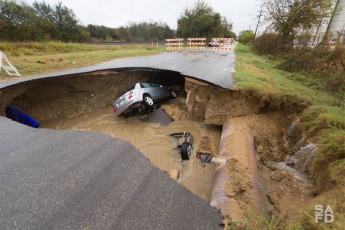 Massive Sinkhole Swallows Two Cars In Texas