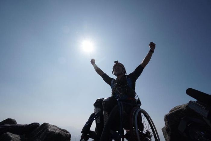 Strong Man In A Wheelchair Climbs A Mountain In China