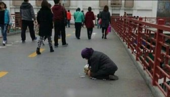 See What This Beggar Does When She's Handed Food