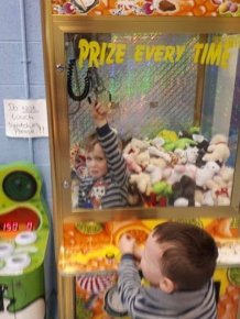 Kid Gets Extra Prizes After Getting Stuck In The Machine