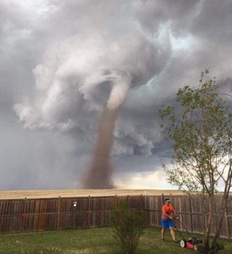 Canadian Man Shows No Fear By Mowing Lawn During A Tornado