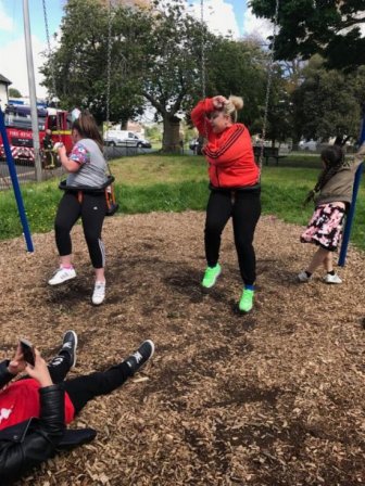 Aunt And Niece Get Stuck In Children's Swing