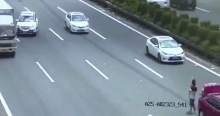 Couple Holding Baby Almost Get Killed By Oncoming Car
