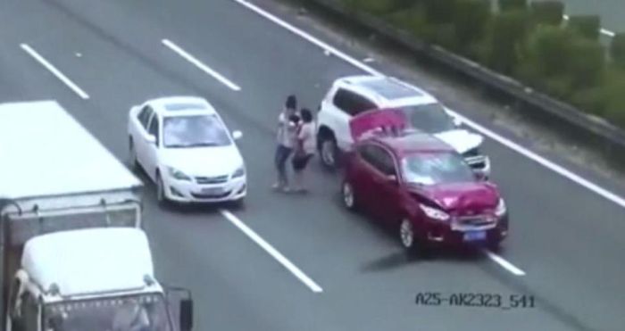 Couple Holding Baby Almost Get Killed By Oncoming Car