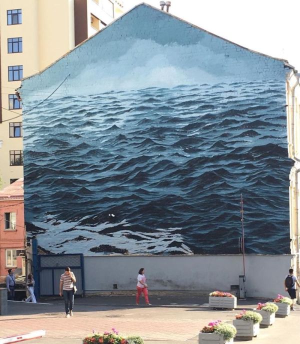 Ferocious Black Sea Covers The Wall Of A Three Story Building
